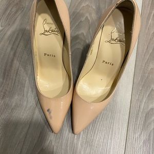 Red shoes with scuff marks